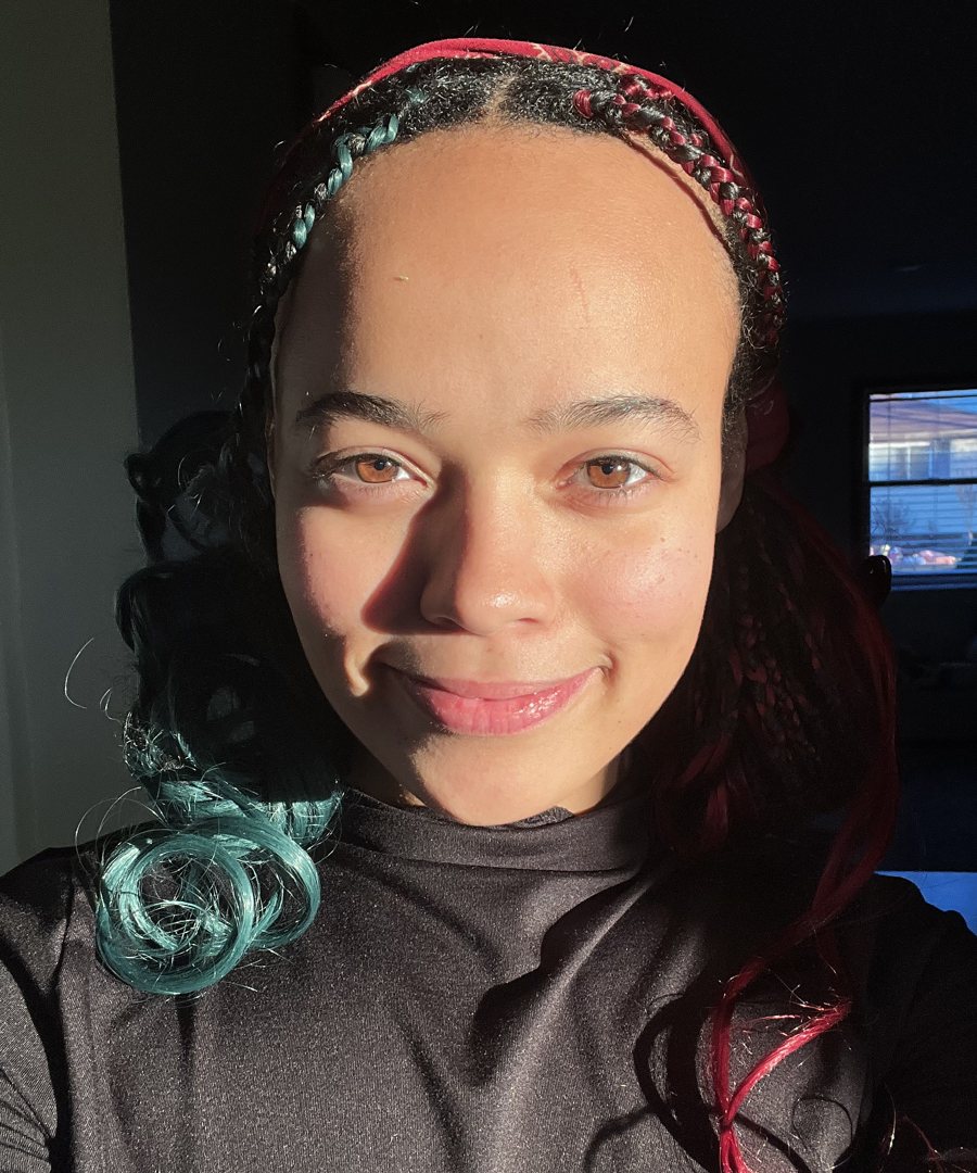 Esther Joy Sherry, smiling in golden sunlight